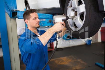 Mechanic adjusting the tire wheel