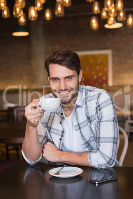 Young man having cup of coffee