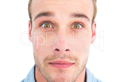 Surprised man in shirt looking at camera