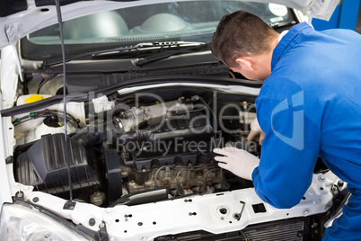 Mechanic working under the hood