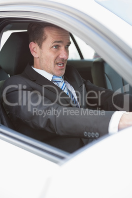 Businessman nearly crashing his car