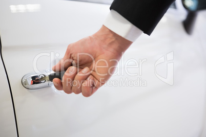 Man opening a car with a key