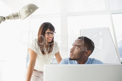 Business coworkers smiling at each other