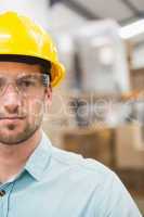 Close up of worker wearing hard hat in warehouse