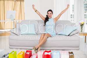 Stylish brunette with many shopping bags