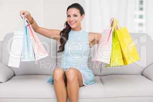 Stylish brunette with shopping bags