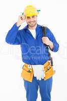 Happy repairman wearing yellow hardhat