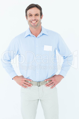 Confident businessman with hands on hip