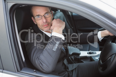 Handsome businessman looking at camera