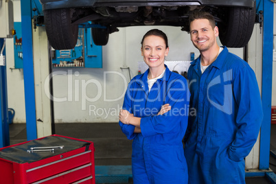 Team of mechanics smiling at camera