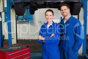 Team of mechanics smiling at camera