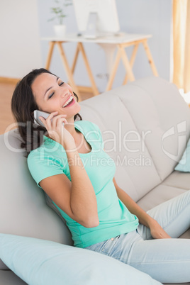 Pretty brunette laughing on the phone Pretty brunette laughing on the phone