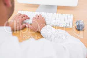 Businessman typing on computer keyboard