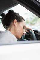 Woman sleeping on the wheel