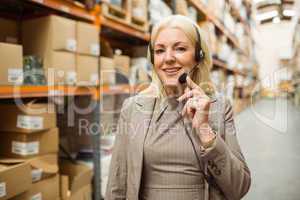 Smiling woman wearing a headset