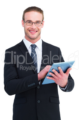 Happy businessman using his tablet pc