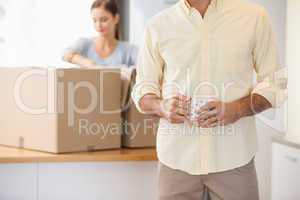 Young couple unpacking boxes in kitchen