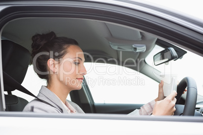 Young businesswoman having a coffee