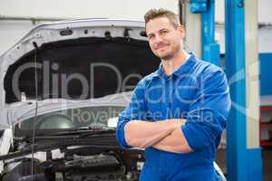 Mechanic smiling at the camera