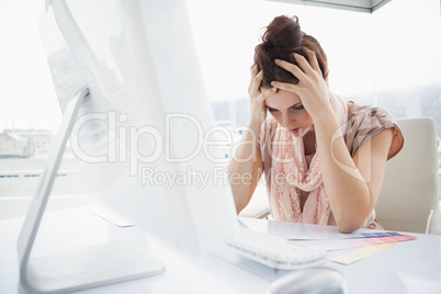 Exhausted businesswoman working with colour sample