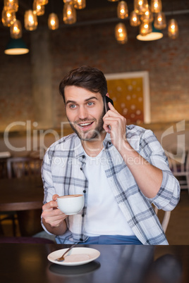 Young man having cup of coffee
