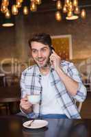 Young man having cup of coffee