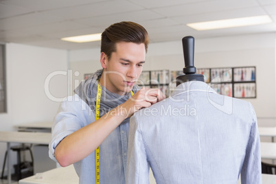 Fashion student working on mannequin