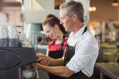 Barista making cup of coffee