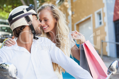 Cute couple riding a scooter