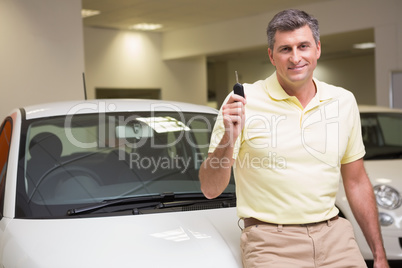 Customer standing while holding car key