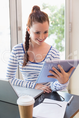 Pretty brunette catching up on work