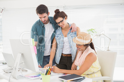 Couple with colleague working with colour wheel
