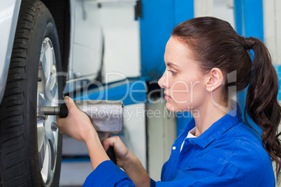 Mechanic adjusting the tire wheel