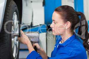 Mechanic adjusting the tire wheel