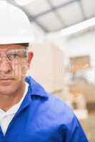 Worker wearing hard hat in warehouse