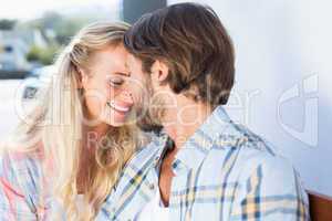 Attractive couple sitting on bench