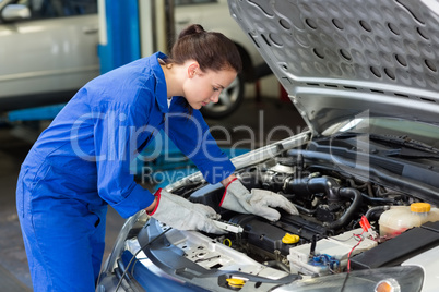 Mechanic working under the hood