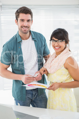 Portrait of smiling designer with her client