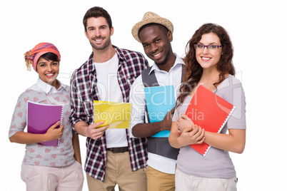 Smiling university students holding notebook