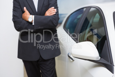 Close up of businessman standing with arms crossed