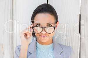 Stylish brunette thinking and smiling