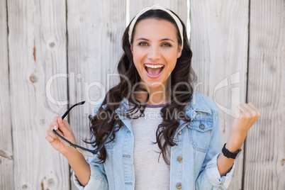 Pretty hipster cheering and smiling