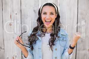 Pretty hipster cheering and smiling