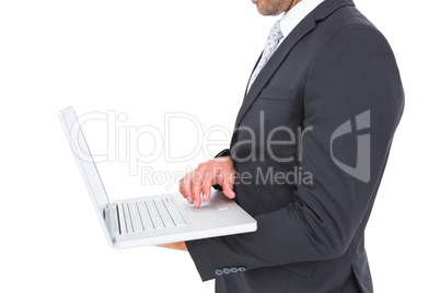 Businessman holding laptop