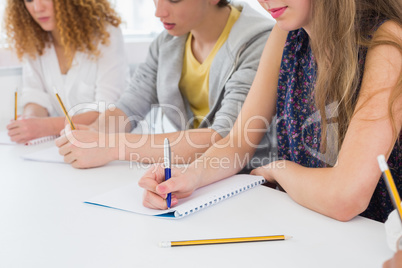 Students taking notes in class