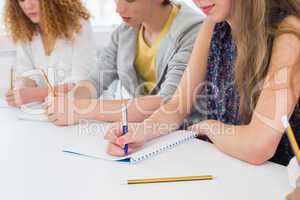 Students taking notes in class