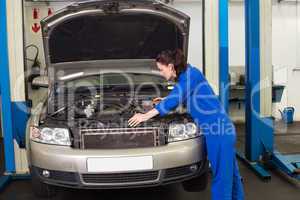 Mechanic working under the hood