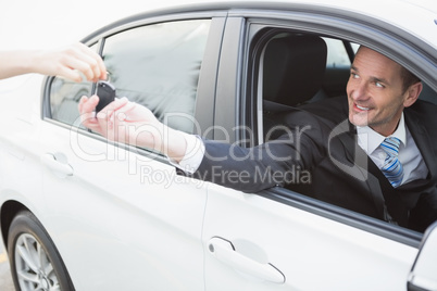 Businessman sitting in drivers seat