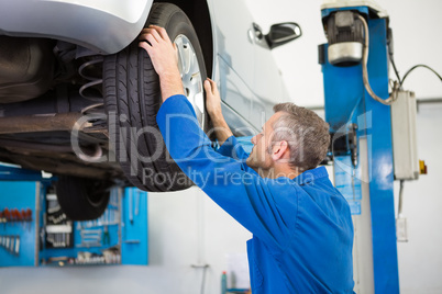 Mechanic adjusting the tire wheel