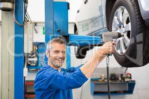 Mechanic adjusting the tire wheel